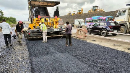 Navi Mumbai International Airport inauguration preparation road divider being painted Navi Mumbai International Airport inauguration preparation road divider being painted