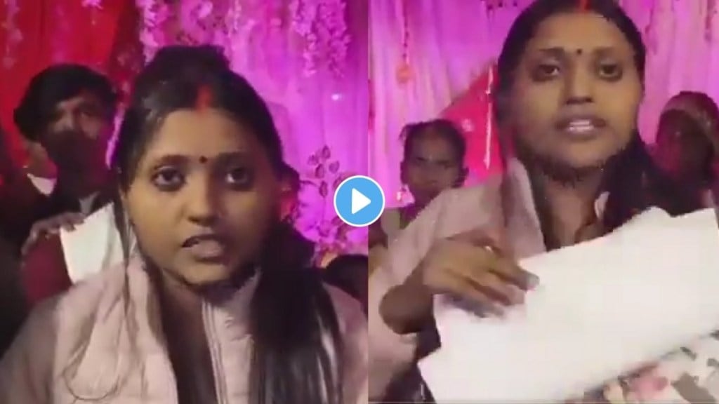 Groom’s first wife arrives on stage during the garland ceremony.