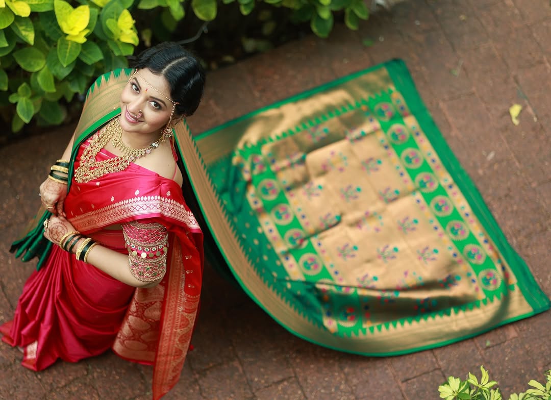 Tejashri Pradhan in red-green Maharashtrian bridal look.