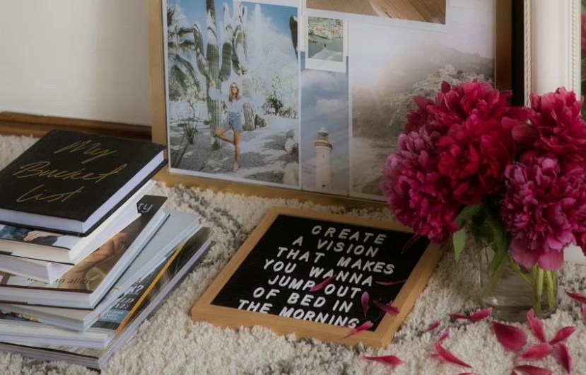 Person visualizing goals with positive energy, symbolizing manifestation.