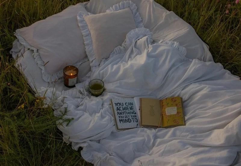 Person visualizing goals with positive energy, symbolizing manifestation.