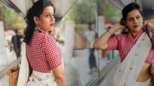 Amruta Bane in white saree and red checked blouse.