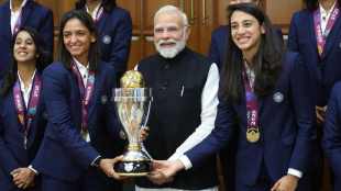 PM Narendra Modi Doesnt touch Women World Cup Trophy While Team Photo Out of Respect