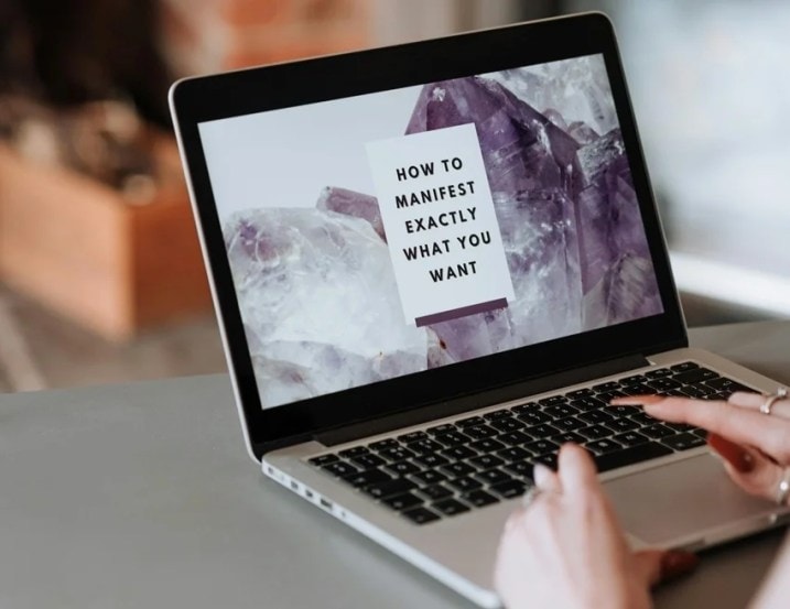 Person visualizing goals with positive energy, symbolizing manifestation.