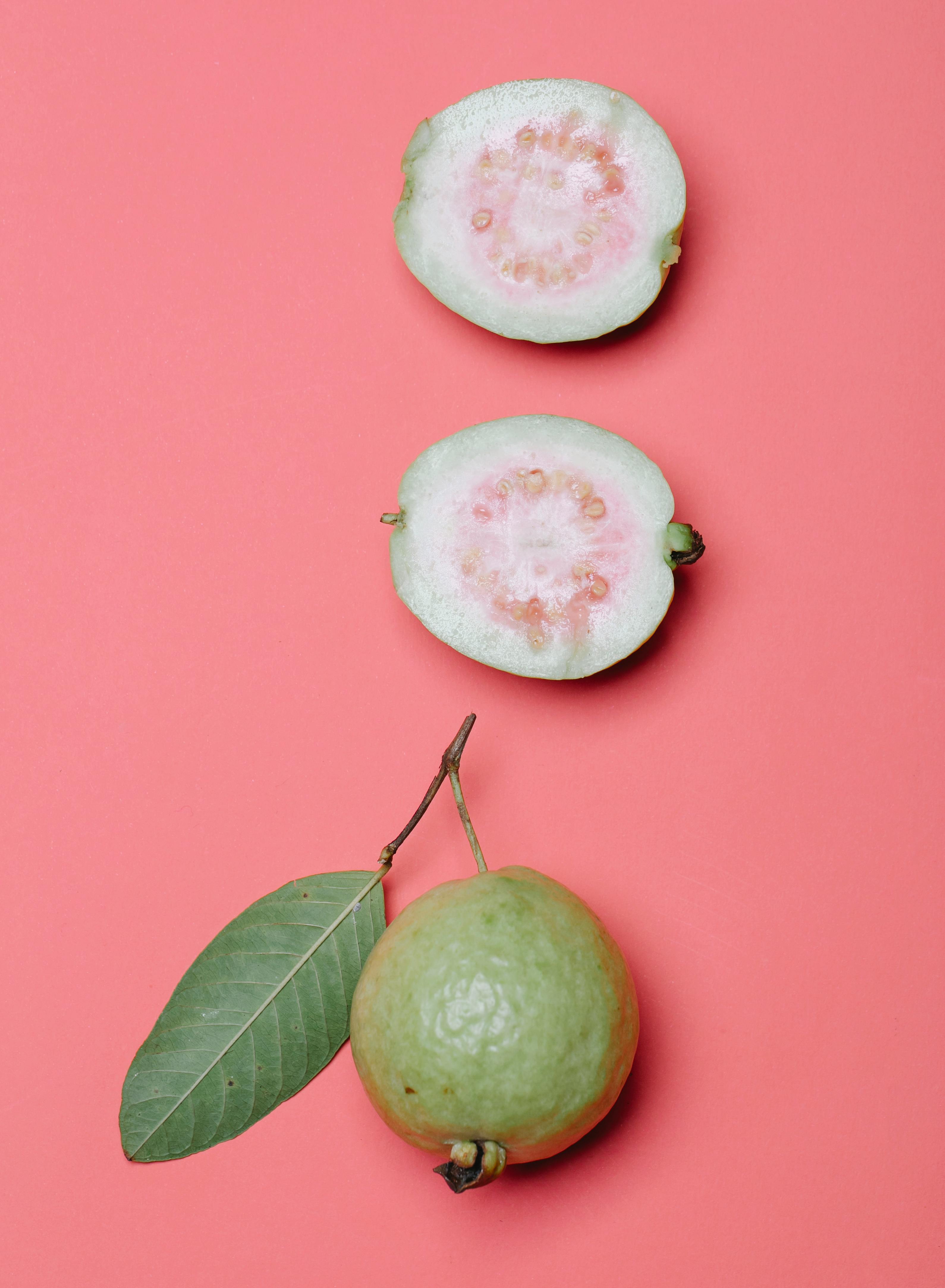 Fresh guava without peel showing natural texture and slices rich in nutrients