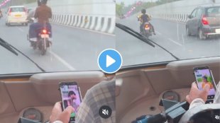 On-road reel addiction! Auto driver caught scrolling while driving goes viral.
