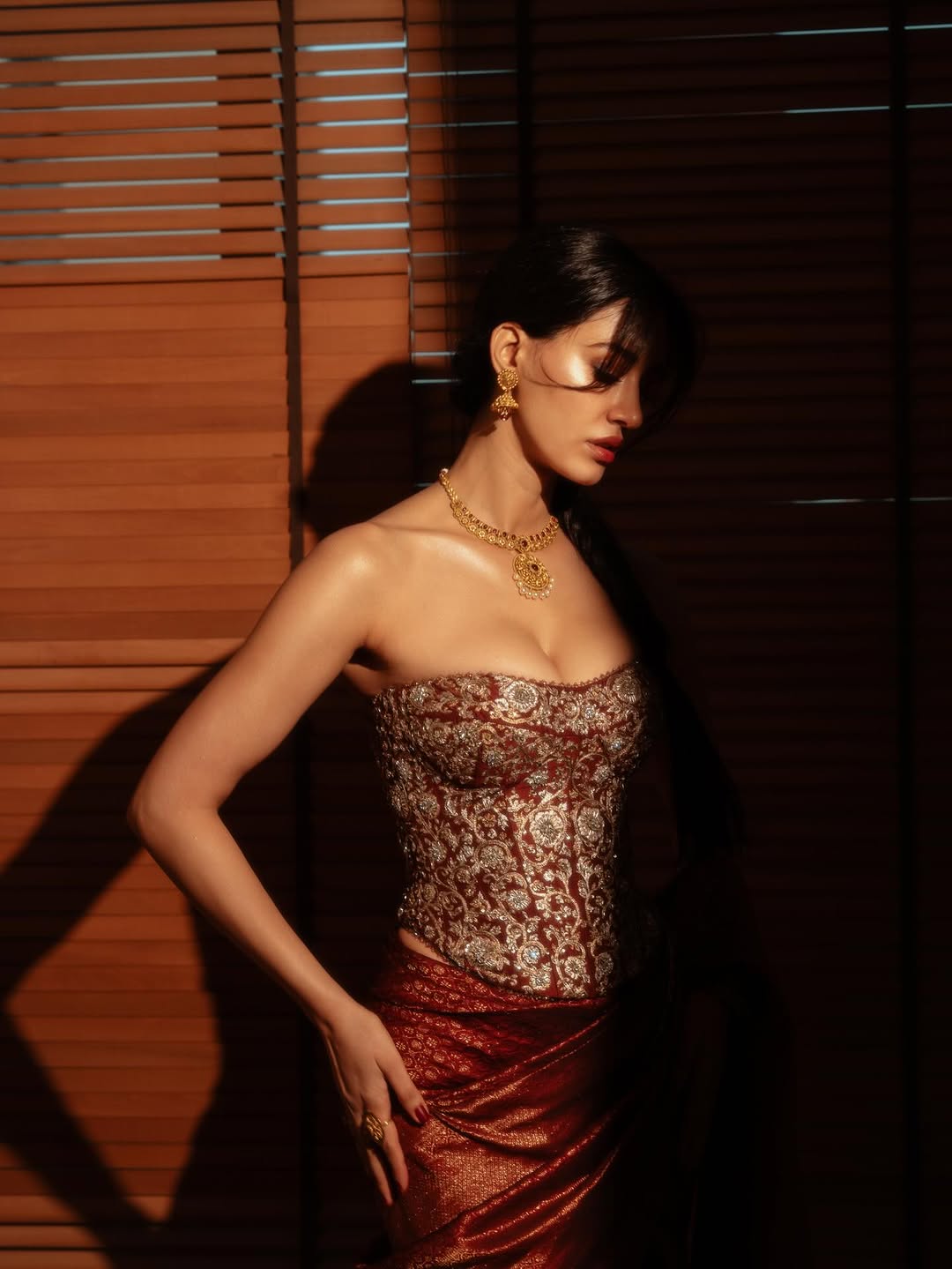 Disha Patani stuns in red saree at recent event