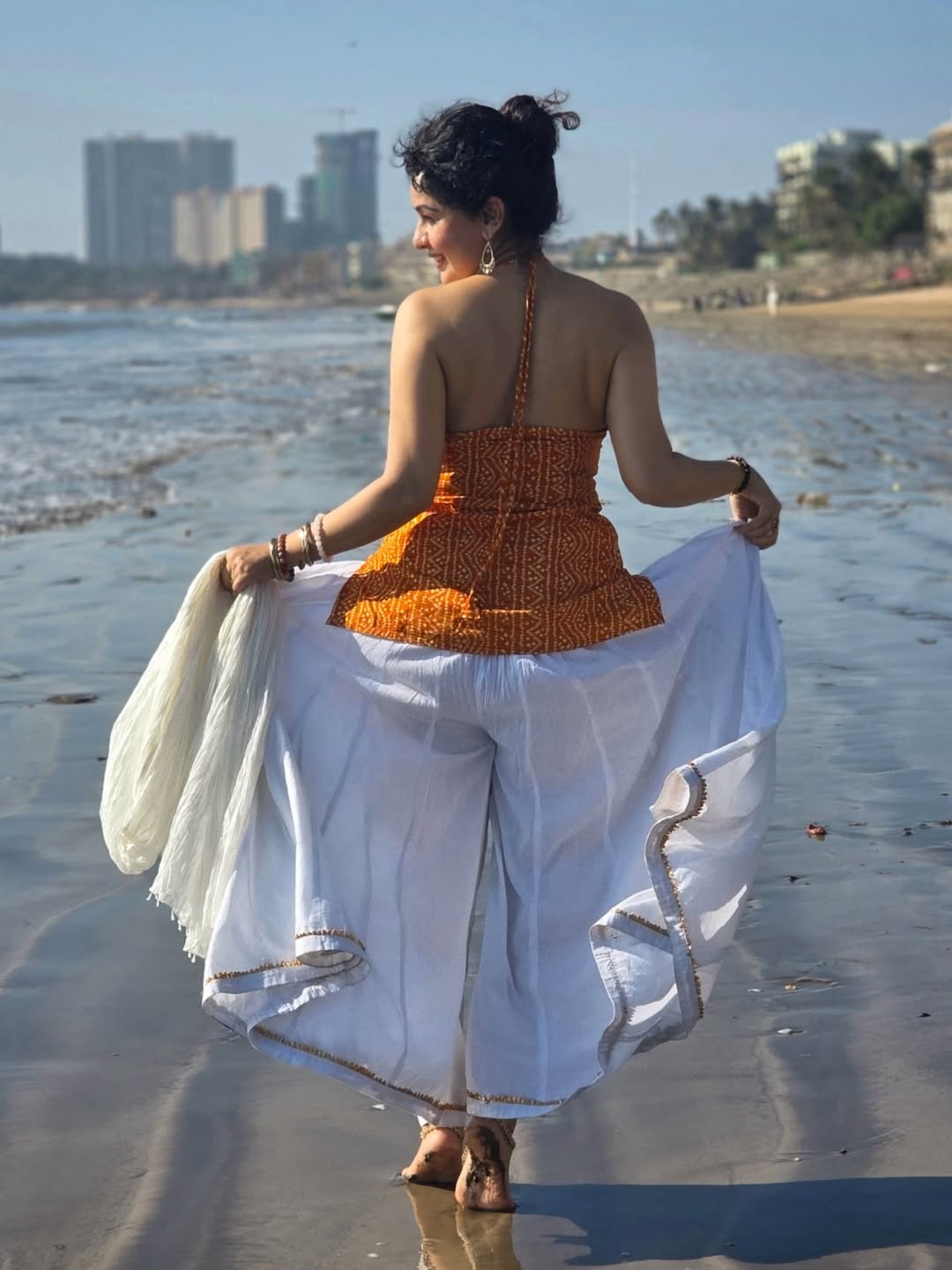 Sukhada Khandkekar glamorous beach photoshoot bandhani halter neck top look