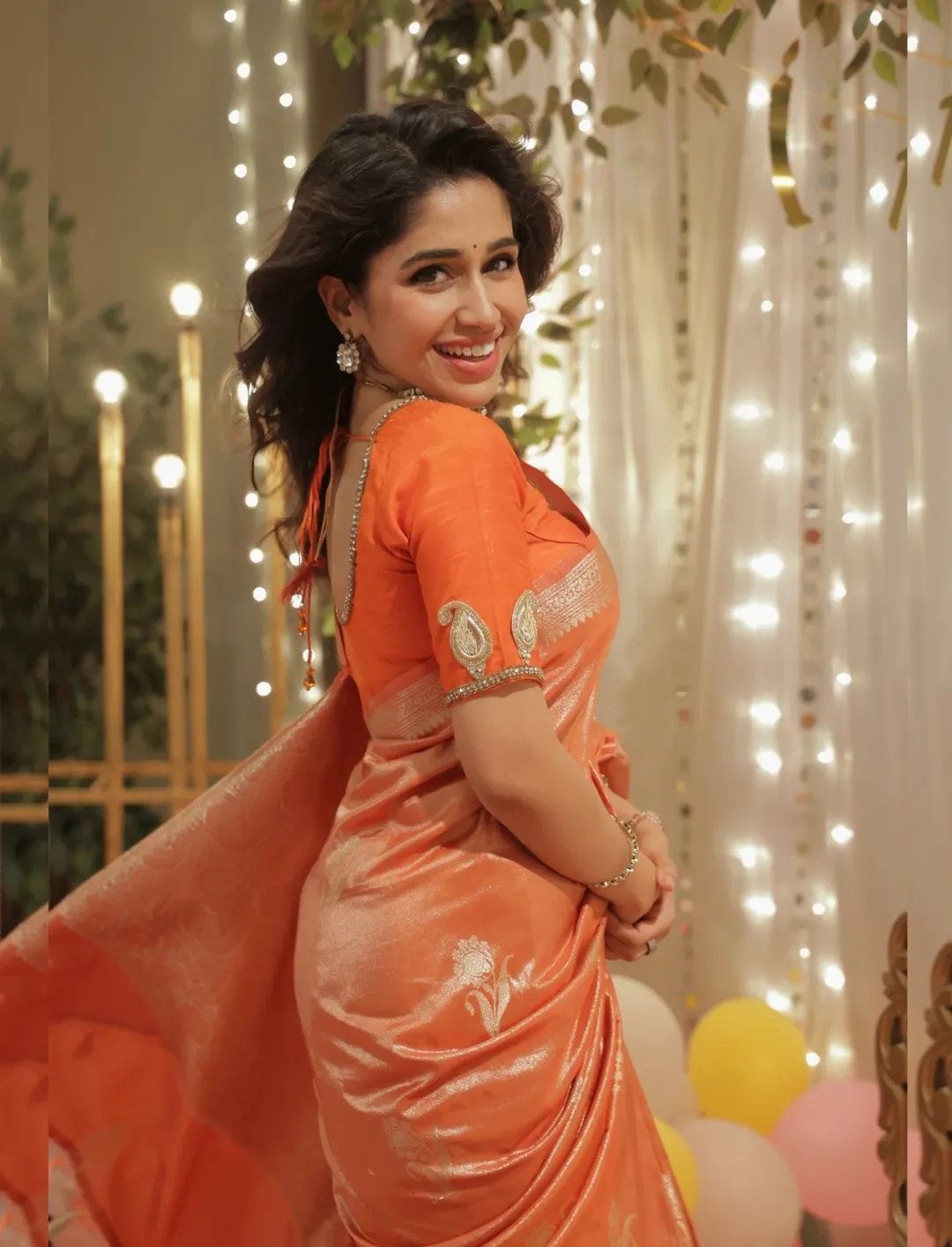 Purniemaa Dey Orange Saree Look