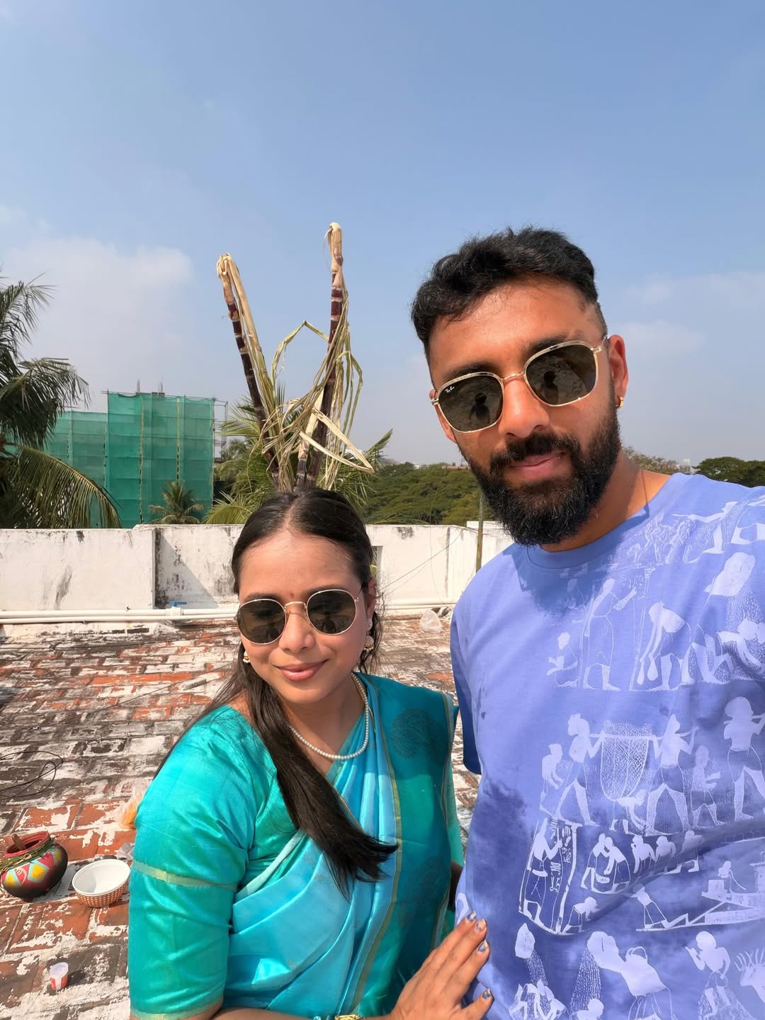 Varun Chakravarthy wife Neha Khedekar