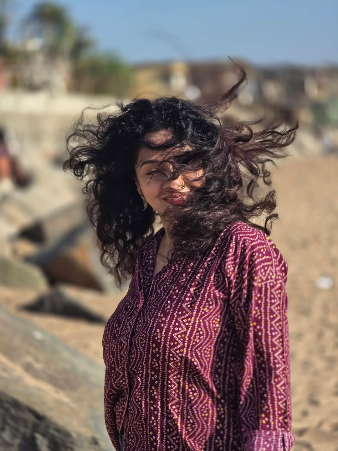 Sukhada Khandkekar beach photoshoot bandhani print shirt look