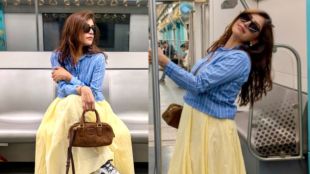 Actress Meera Jagannath posing at Mumbai Metro 3 station in a yellow dress.