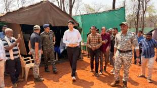 Gadchiroli District Collector Avishyant Panda visit Binagunda village | Gadchiroli naxalite area development news | Binagunda waterfall tourism project | Maharashtra tribal area administration visit