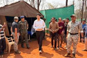 Gadchiroli District Collector Avishyant Panda visit Binagunda village | Gadchiroli naxalite area development news | Binagunda waterfall tourism project | Maharashtra tribal area administration visit