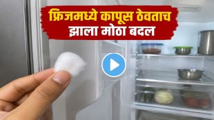 Woman cleaning refrigerator rubber gasket using cotton to reduce electricity consumption