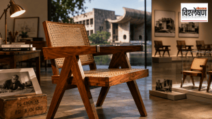 Pierre Jeanneret's iconic Chandigarh Chair displayed in a museum-inspired setting with Chandigarh's modernist architecture in the background.