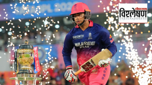 Vaibhav Suryavanshi of Rajasthan Royals walks onto the field with a cricket bat beside the IPL trophy amid fireworks during an IPL match: राजस्थान रॉयल्सचा युवा फलंदाज वैभव सूर्यवंशी आयपीएल ट्रॉफीजवळ हातात बॅट घेऊन मैदानात प्रवेश करताना, पार्श्वभूमीला फटाक्यांची आतषबाजी.