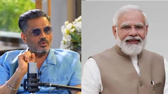 Suniel Shetty Granddaughter Evaarah feeding laddu to PM Narendra Modi Photo