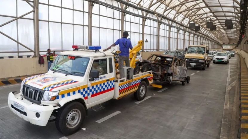 car being towed out of the tunnel