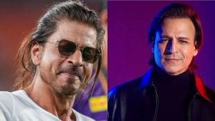 Bollywood actors Shah Rukh Khan and Vivek Oberoi smiling together